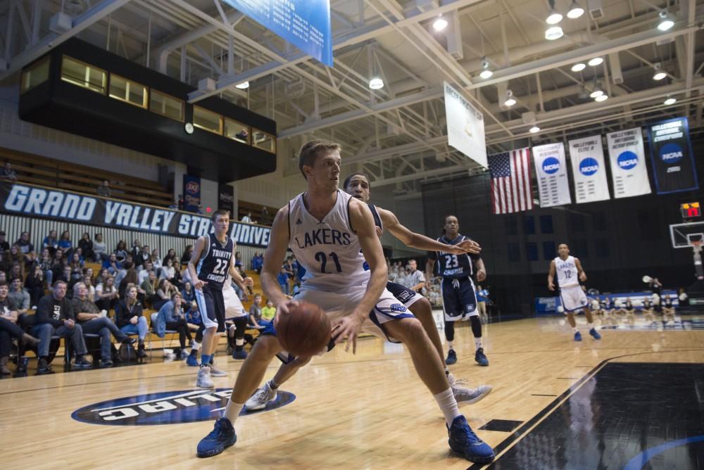 GVL / Luke Holmes - Drake Baar (21) posts up. GVSU defeated Trinity Christian on Friday, Nov. 18, 2016. 