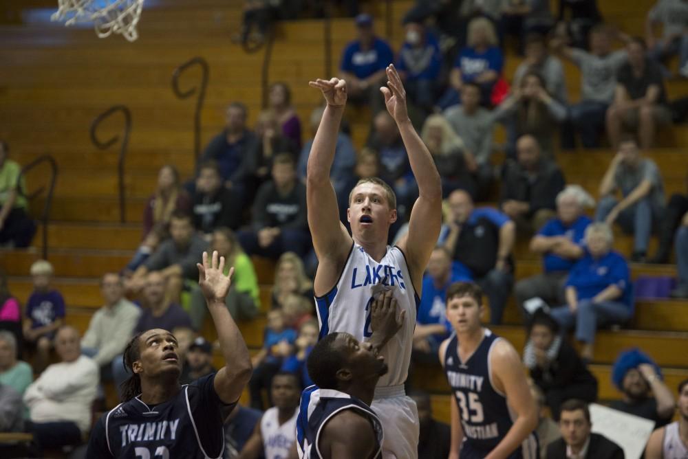 GVL / Luke Holmes - Luke Ryskamp (23) takes a shot. GVSU defeated Trinity Christian on Friday, Nov. 18, 2016. 