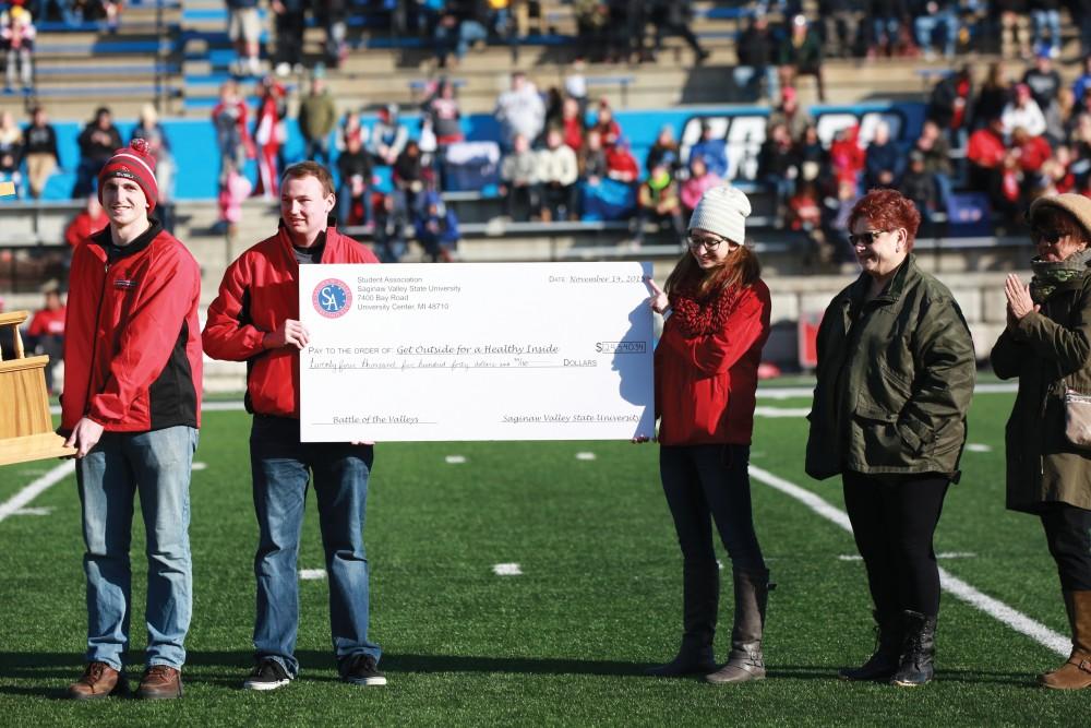 GVL / Kevin Sielaff - The BOTV trophy is presented during halftime.  Grand Valley squares off against SVSU Nov. 14 in Allendale. The Lakers hold on and win with a final score of 24-17.