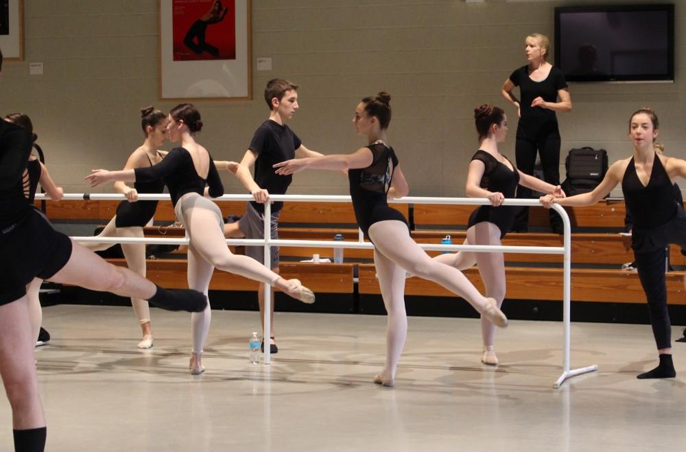 GVSU dance professor Sam Shelton (center back) instructs high school students in ballet technique during Fall Dance Day Friday, Nov. 18.