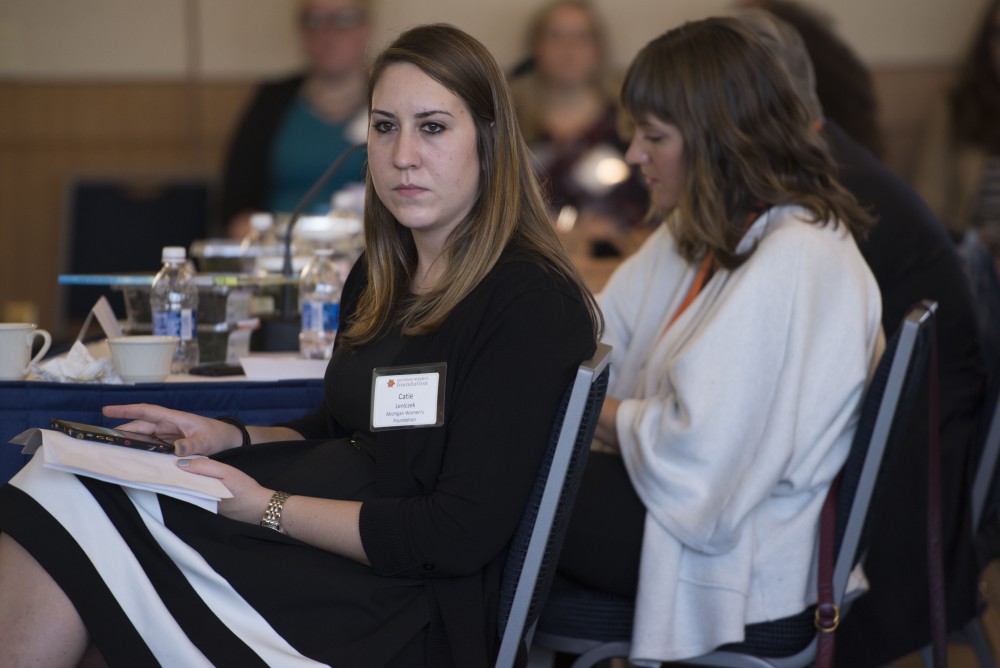 GVL / Luke Holmes - Catie Leniczek takes notes during Zoe Bruyn’s pitch. The final pitch of the Dolphin Tank Competition was held Thursday, Nov. 10, 2016 in the Seidman College of Business.