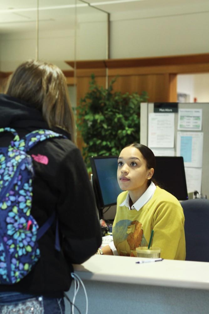 GVL/Archive - Sydney Wiltshire helps a student in the Financial Aid office on Thursday, Feb. 26, 2016 in Allendale. 
