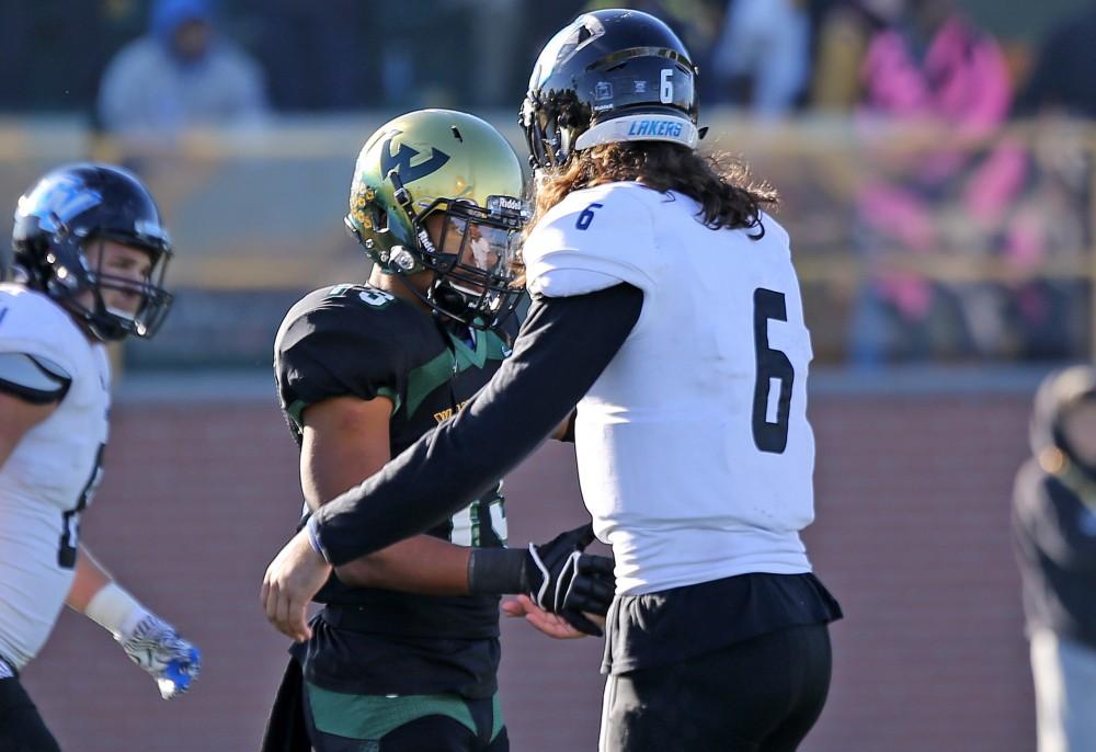 GVL / Emily Frye 
Bart Williams shakes the hand of his opponent after the game against Wayne State University on Saturday Nov. 12, 2016