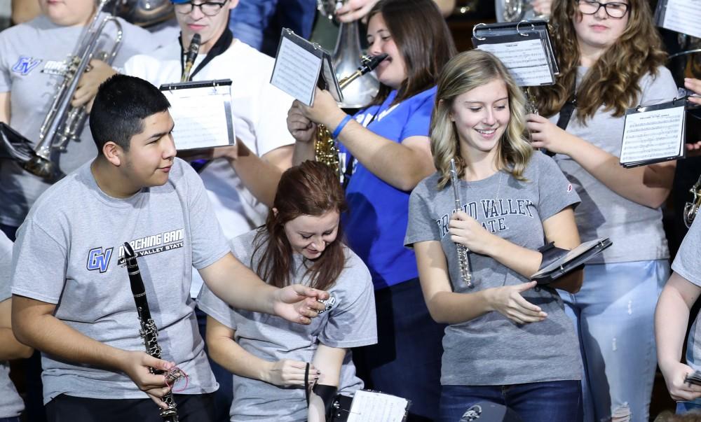 GVL/Kevin Sielaff - The GVSU pep band plays music as spectators wait for Hillary Clinton at Grand Valley State's Fieldhouse Arena on Monday, Nov. 7, 2016. 