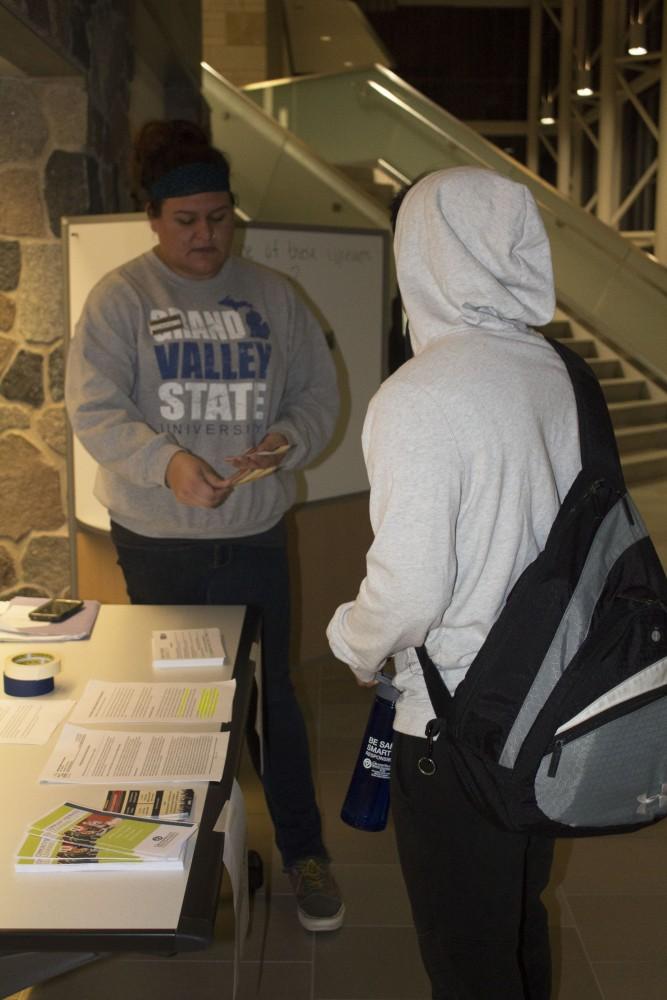 GVL/Mackenzie Bush - Brianna Miranda (left) and Jorge Cole (right). The Community Service Learning Center gets students thinking about the big questions of hunger and homelessness Tuesday, Nov. 15, 2016 in the library. 