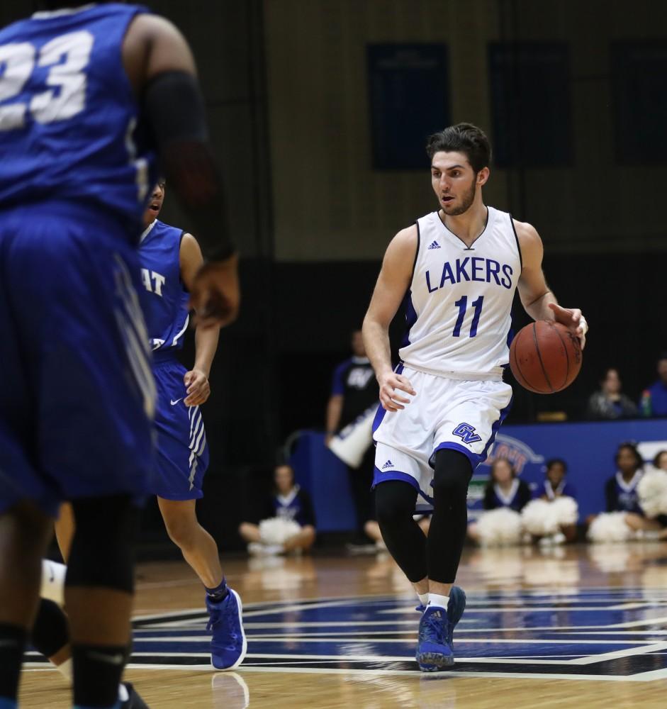 GVL/Kevin Sielaff - Zach West (11) drives the ball up the floor during the game versus Great Lakes Christian on Wednesday, Nov. 16, 2016.