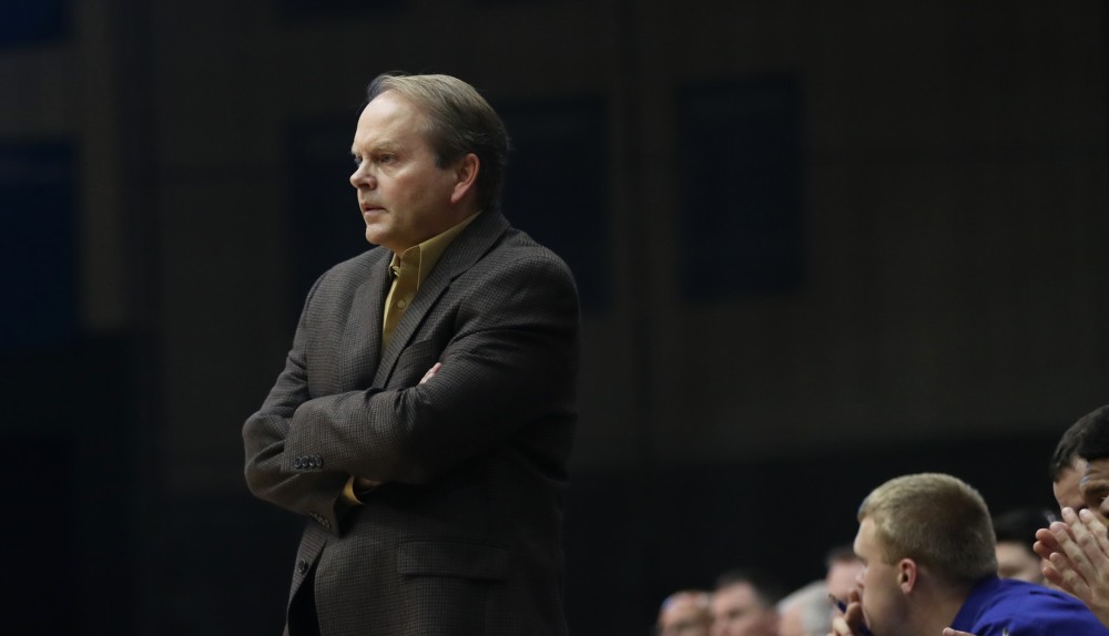 GVL/Kevin Sielaff - Head coach Ric Wesley looks on toward the play from the Grand Valley bench during the game versus Great Lakes Christian on Wednesday, Nov. 16, 2016.