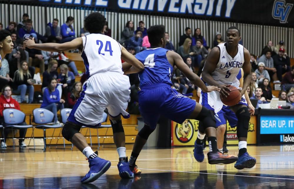 GVL/Kevin Sielaff - Trevin Alexander (5) goes up for a jump shot during the game versus Great Lakes Christian on Wednesday, Nov. 16, 2016.