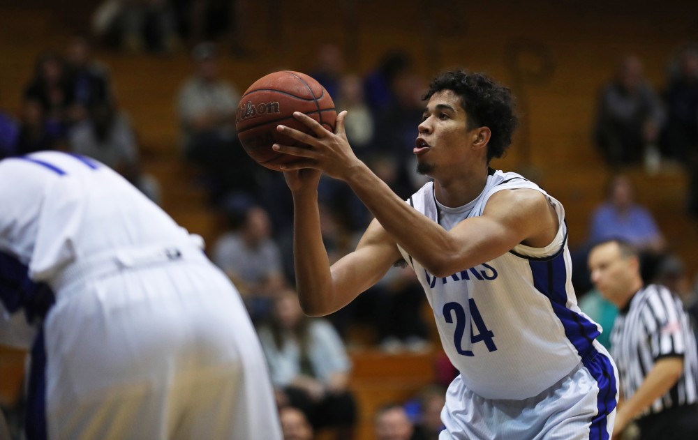 GVL/Kevin Sielaff - Justin Greason (24) steps up for a free throw during the game versus Great Lakes Christian on Wednesday, Nov. 16, 2016.