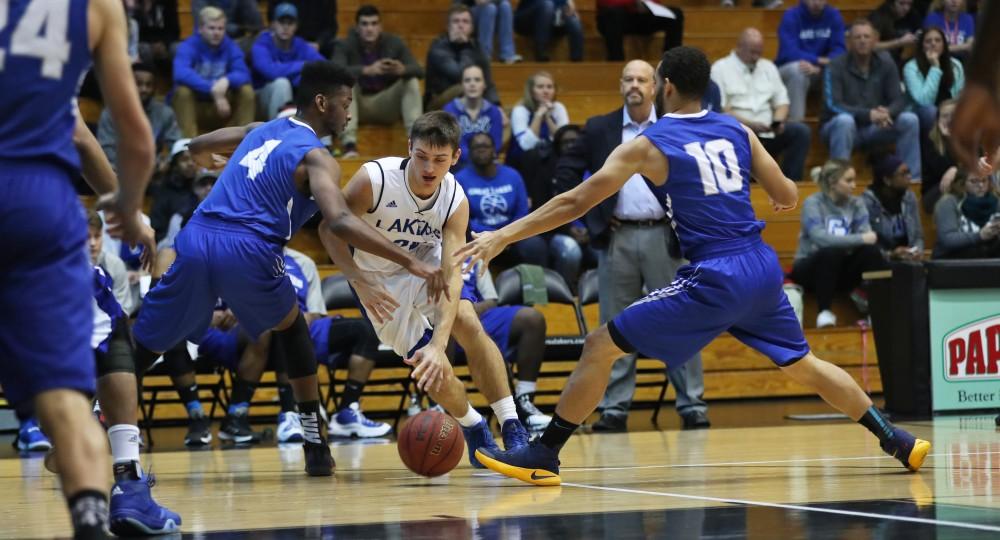 GVL/Kevin Sielaff - Alec Marty (20) splits the defense and goes in for a lay-up during the game versus Great Lakes Christian on Wednesday, Nov. 16, 2016.