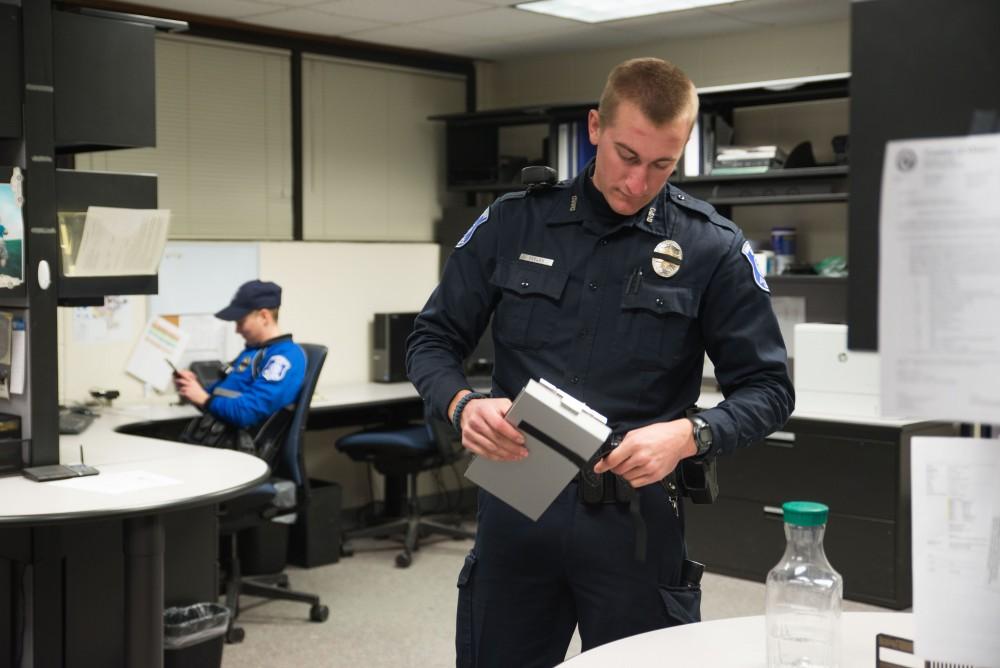 GVL / Luke Holmes - Officer Beelen gets set for his patrol in the office. The ride along with Sergeant Jeff Stoll took place on Saturday, Oct. 29, 2016.