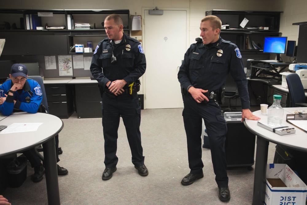 GVL / Luke Holmes - The team debriefs in the office before the night shift begins. The ride along with Sergeant Jeff Stoll took place on Saturday, Oct. 29, 2016.