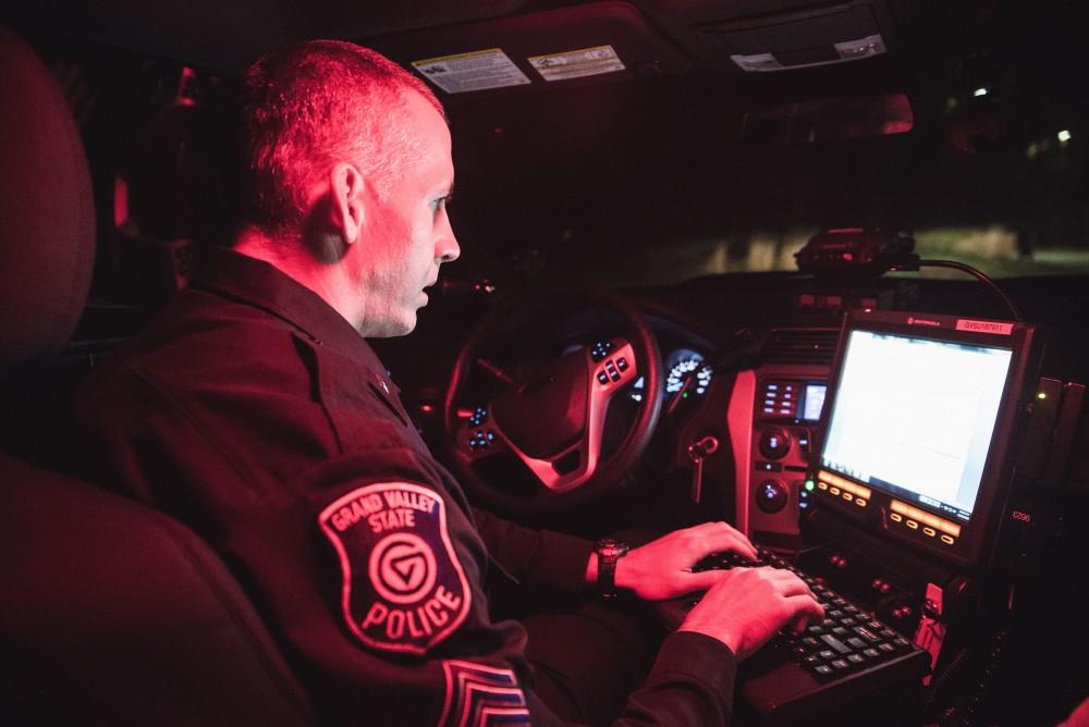 GVL / Luke Holmes - Sergeant Stoll gets set up to begin his night patrol. The ride along with Sergeant Jeff Stoll took place on Saturday, Oct. 29, 2016.