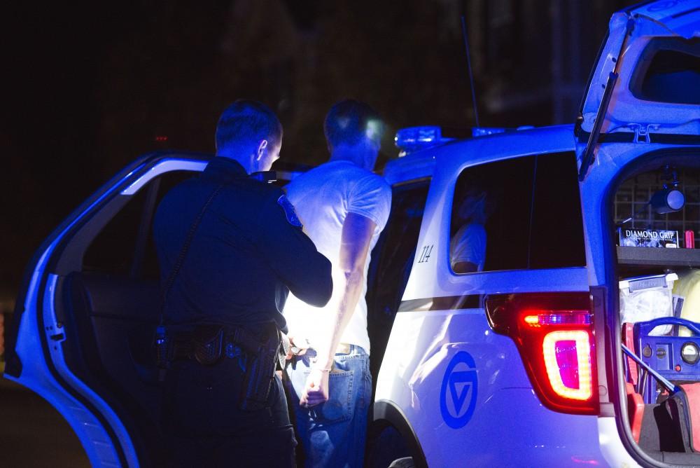 GVL / Luke Holmes - Officer Beelen detains a subject. The ride along with Sergeant Jeff Stoll took place on Saturday, Oct. 29, 2016.