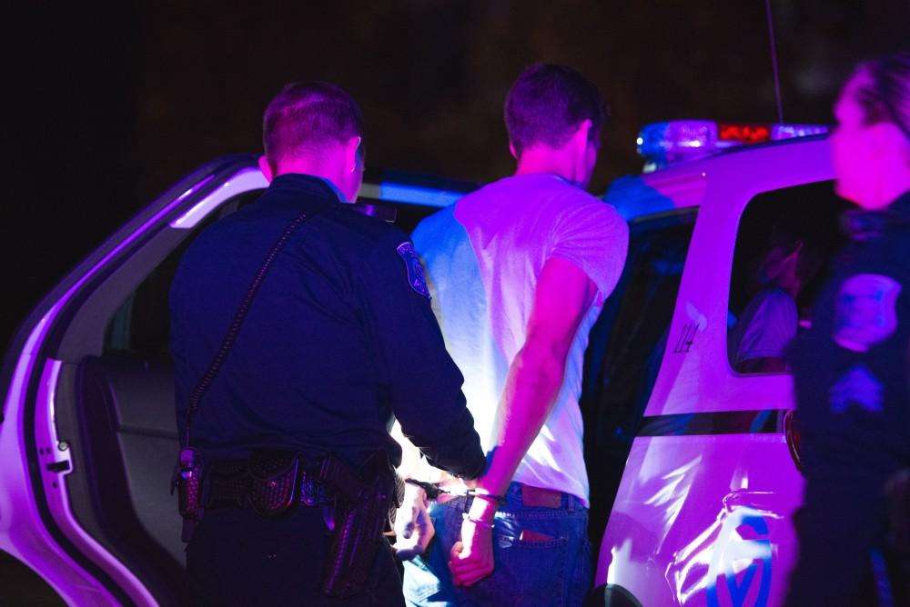 GVL / Luke Holmes - Officer Beelen detains a subject. The ride along with Sergeant Jeff Stoll took place on Saturday, Oct. 29, 2016.