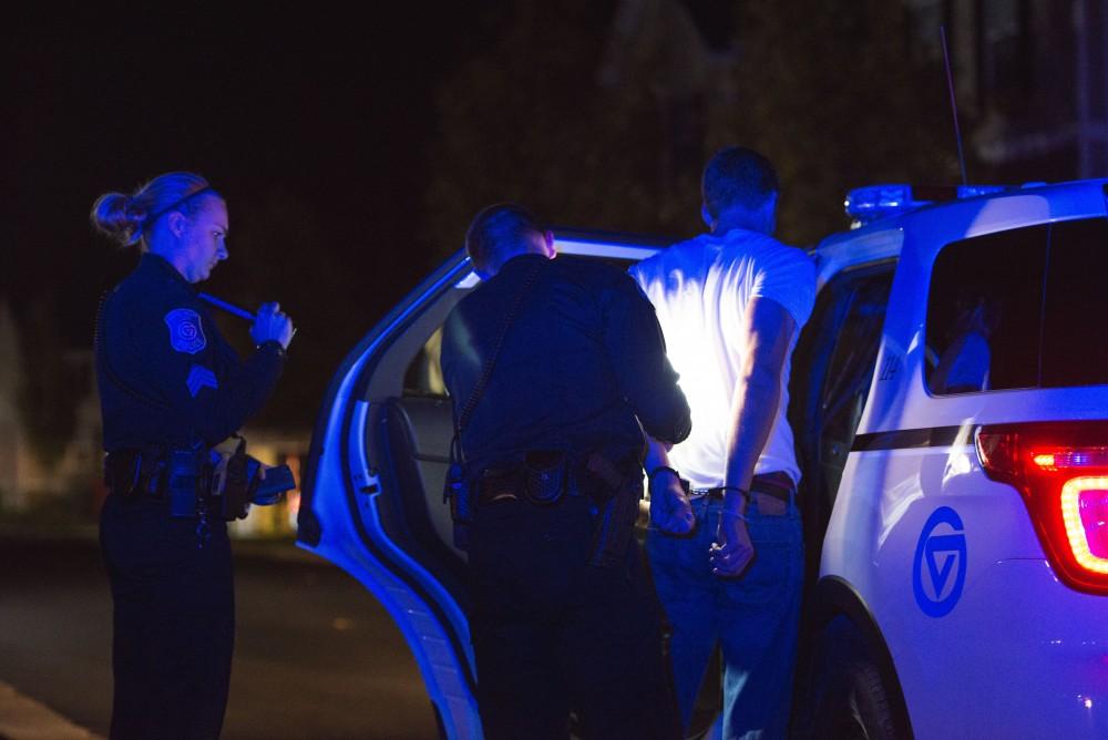 GVL / Luke Holmes - Officer Beelen detains a subject. The ride along with Sergeant Jeff Stoll took place on Saturday, Oct. 29, 2016.