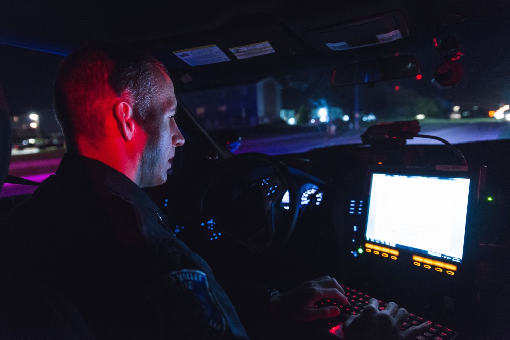 GVL / Luke Holmes - Sergeant Stoll enters information into his computer. The ride along with Sergeant Jeff Stoll took place on Saturday, Oct. 29, 2016.