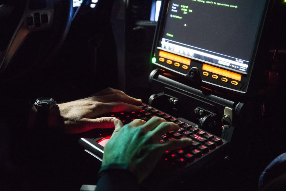 GVL / Luke Holmes - Sergeant Stoll enters information into his computer. The ride along with Sergeant Jeff Stoll took place on Saturday, Oct. 29, 2016.