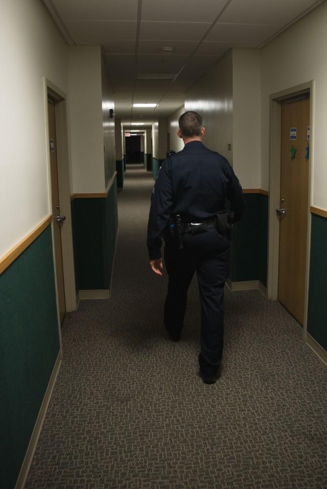 GVL / Luke Holmes - Sergeant Stoll enters an on-campus living center. The ride along with Sergeant Jeff Stoll took place on Saturday, Oct. 29, 2016.