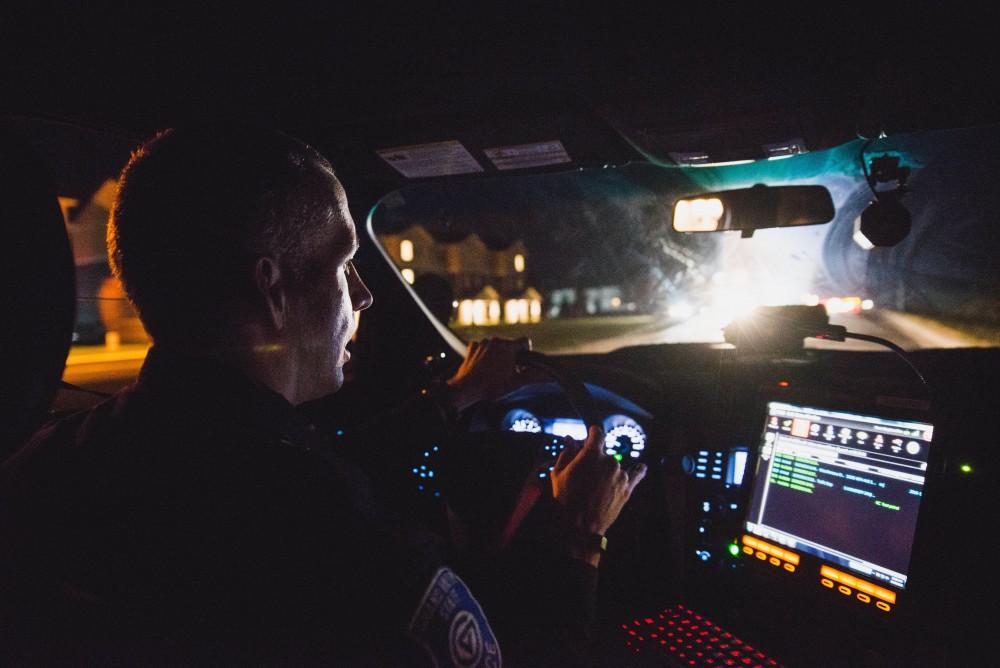 GVL / Luke Holmes - Sergeant Stoll glances at his computer screen en route to a call. The ride along with Sergeant Jeff Stoll took place on Saturday, Oct. 29, 2016.