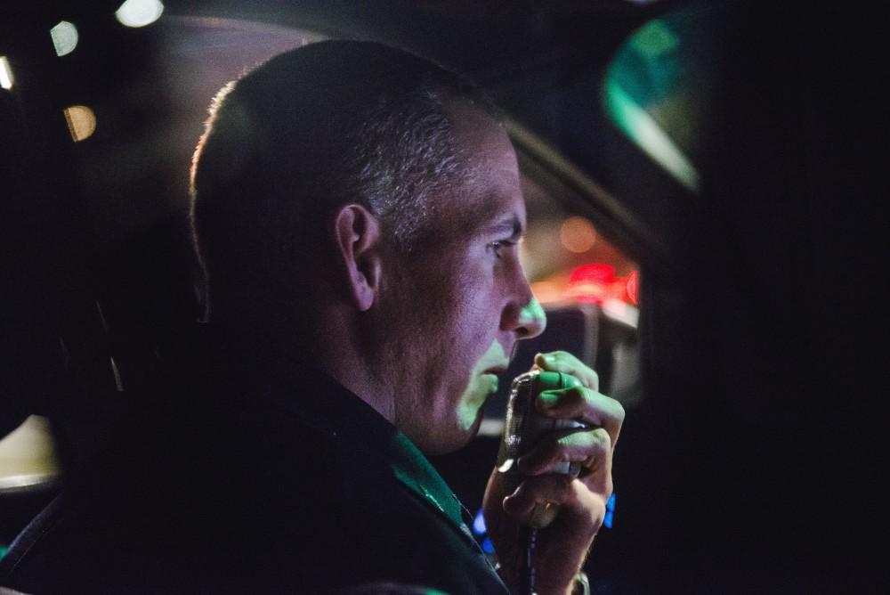 GVL / Luke Holmes - Sergeant Stoll communicates with a dispatcher over the radio. The ride along with Sergeant Jeff Stoll took place on Saturday, Oct. 29, 2016.