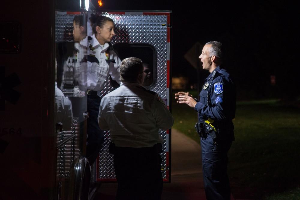 GVL / Luke Holmes - Sergeant Stoll speaks with the operators of the ambulance after a medical emergency. The ride along with Sergeant Jeff Stoll took place on Saturday, Oct. 29, 2016.