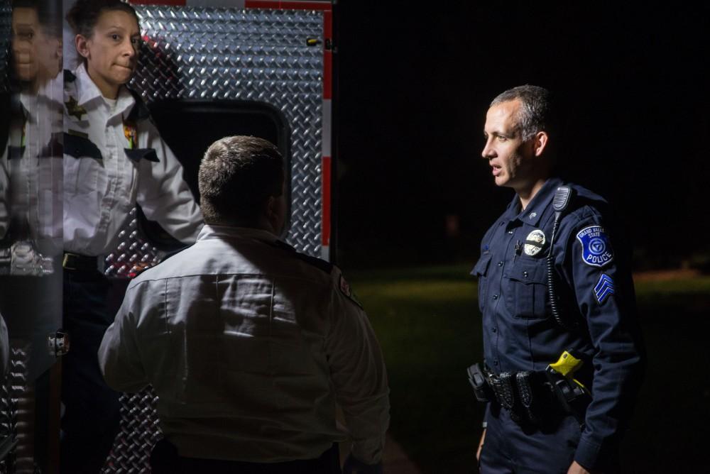 GVL / Luke Holmes - Sergeant Stoll speaks with the operators of the ambulance after a medical emergency. The ride along with Sergeant Jeff Stoll took place on Saturday, Oct. 29, 2016.