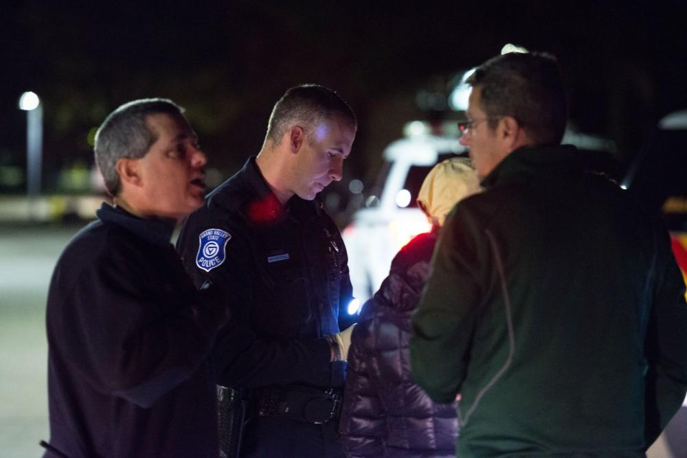 GVL / Luke Holmes - Sergeant Stoll speaks with the parents of an underaged drinker who had a medical emergency. The ride along with Sergeant Jeff Stoll took place on Saturday, Oct. 29, 2016.