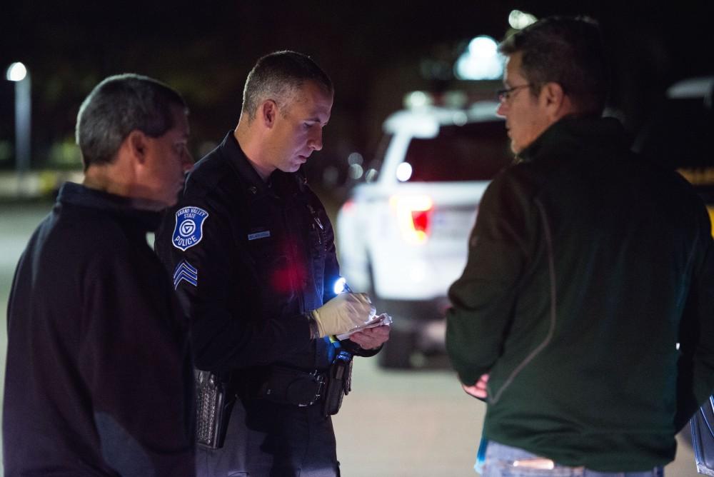 GVL / Luke Holmes - Sergeant Stoll speaks with the parents of an underaged drinker who had a medical emergency. The ride along with Sergeant Jeff Stoll took place on Saturday, Oct. 29, 2016.