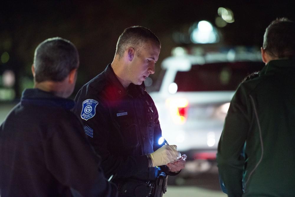 GVL / Luke Holmes - Sergeant Stoll speaks with the parents of an underaged drinker who had a medical emergency. The ride along with Sergeant Jeff Stoll took place on Saturday, Oct. 29, 2016.