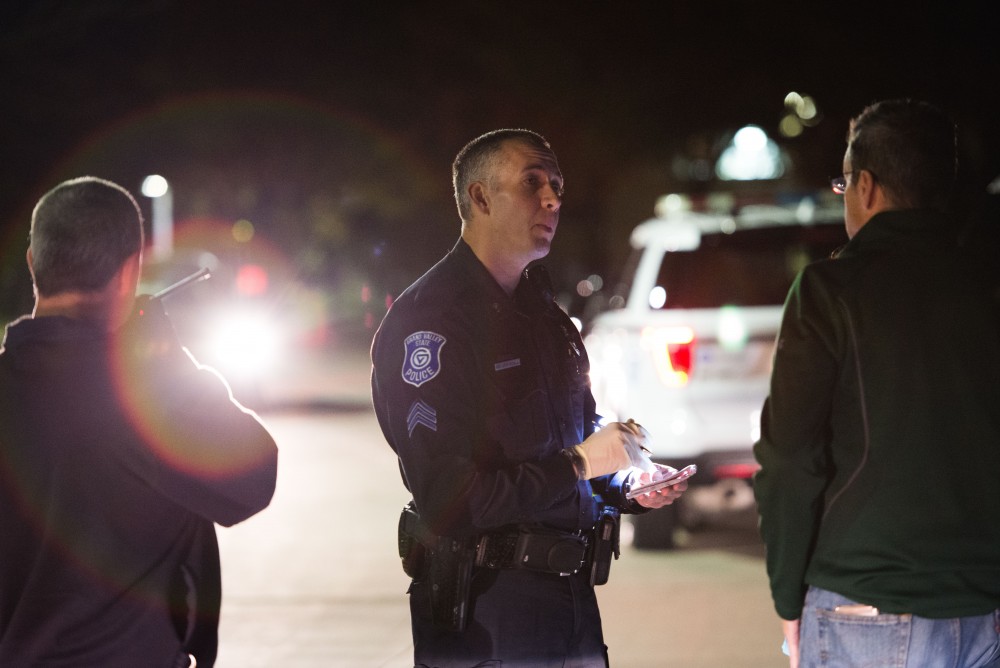 GVL / Luke Holmes - Sergeant Stoll speaks with the parents of an underaged drinker who had a medical emergency. The ride along with Sergeant Jeff Stoll took place on Saturday, Oct. 29, 2016.