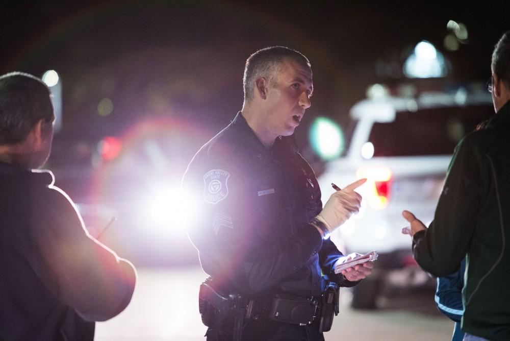 GVL / Luke Holmes - Sergeant Stoll speaks with the parents of an underaged drinker who had a medical emergency. The ride along with Sergeant Jeff Stoll took place on Saturday, Oct. 29, 2016.