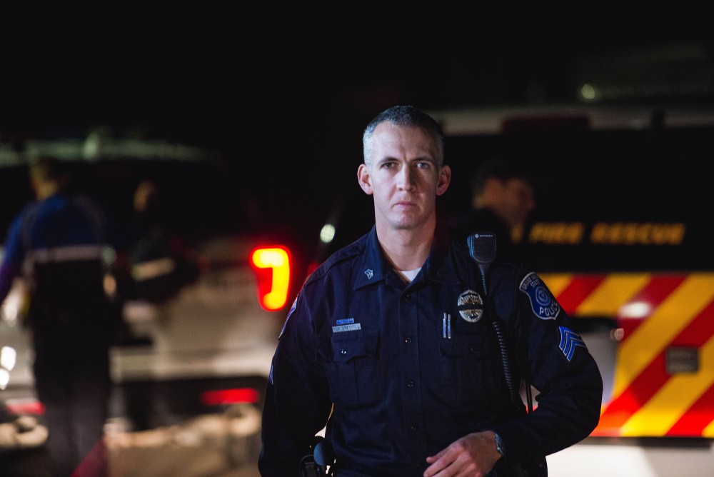 GVL / Luke Holmes - Sergeant Stoll returns to his car. The ride along with Sergeant Jeff Stoll took place on Saturday, Oct. 29, 2016.