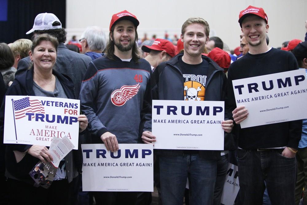 GVL / Emily Frye 
Helen Farr (left), Johnnie Farr (left center), Spencer Reynolds (right center) and Cliff Farr (right) during the rally on Monday Nov. 7, 2016