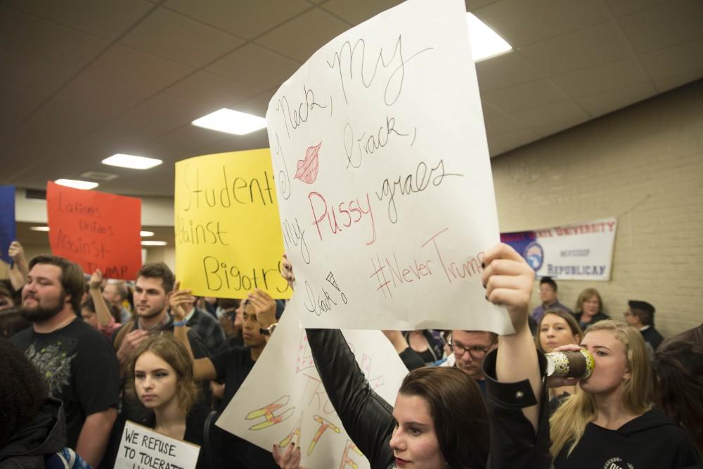 GVL / Luke Holmes - Protesters gather before the speech starts. Donald Trump Jr. came to speak in the Grand Riveer Room on Wednesday, Nov. 2, 2016.