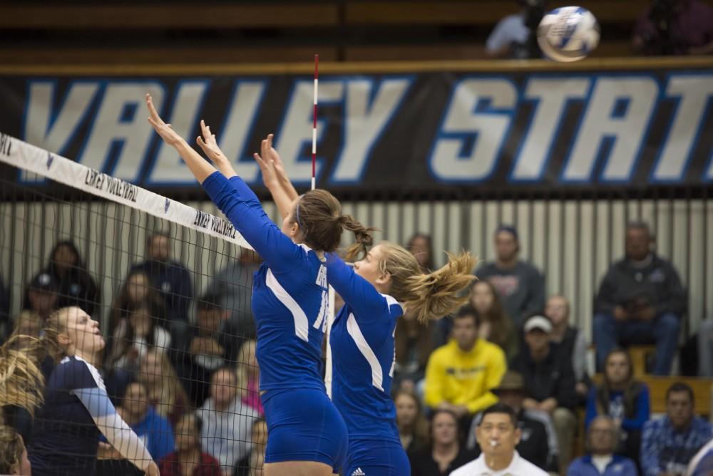 GVL / Luke Holmes - Sydney Doby (16) and Jayci Suseland (15) attempt to block the incoming spike. GVSU volleyball defeated Northwood in three games in the Fieldhouse Arena on Friday, Nov. 11, 2016.