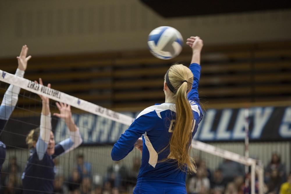 GVL / Luke Holmes - Kendall Yerkes (2) hits the ball over the net. GVSU volleyball defeated Northwood in three games in the Fieldhouse Arena on Friday, Nov. 11, 2016.