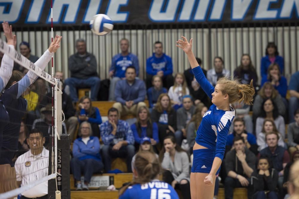 GVL / Luke Holmes - Jayci Suseland (15) hits the ball over the net. GVSU volleyball defeated Northwood in three games in the Fieldhouse Arena on Friday, Nov. 11, 2016.