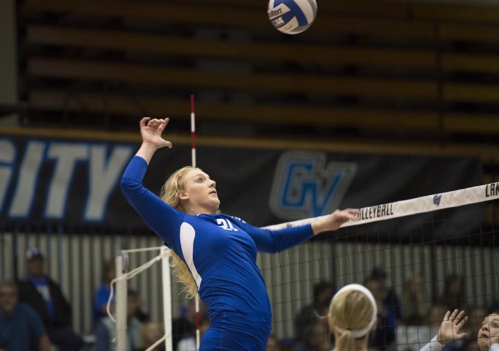 GVL / Luke Holmes - Staci Brower (21) jumps up to spike the ball. GVSU volleyball defeated Northwood in three games in the Fieldhouse Arena on Friday, Nov. 11, 2016.