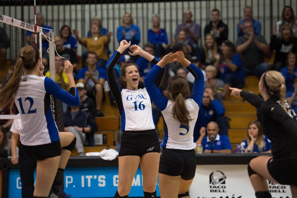 GVL / Luke Holmes - The team celebrates after scoring. GVSU volleyball lost to Michigan Tech on Saturday, Oct. 29. 2016.