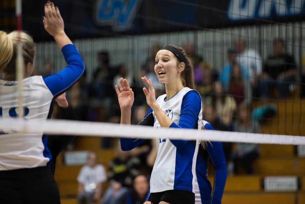 GVL / Luke Holmes - Jillian Butsavich (12) high fives her teammate. GVSU volleyball lost to Michigan Tech on Saturday, Oct. 29. 2016.