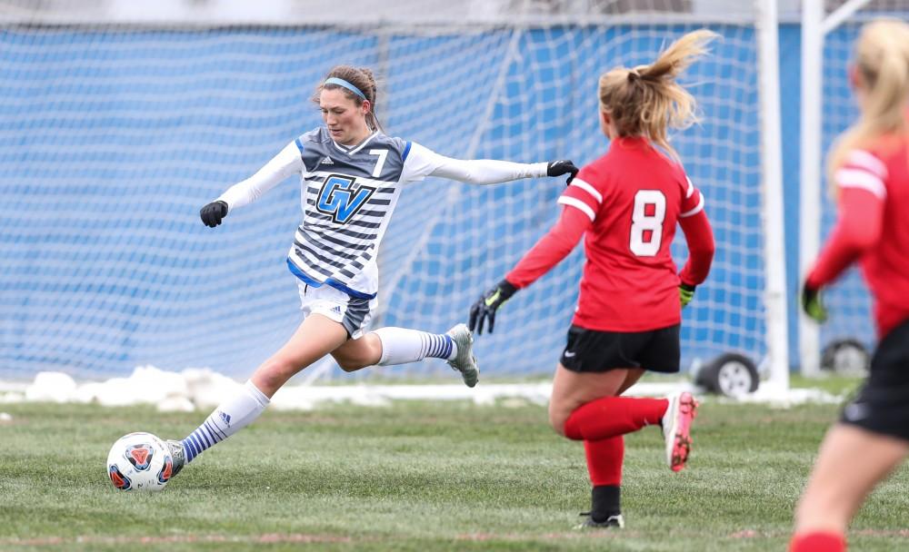 GVL/Kevin Sielaff - Clare Carlson (7) crosses the ball as she moves up field during the game versus Central Missouri on Sunday, Nov. 20, 2016 in Allendale.