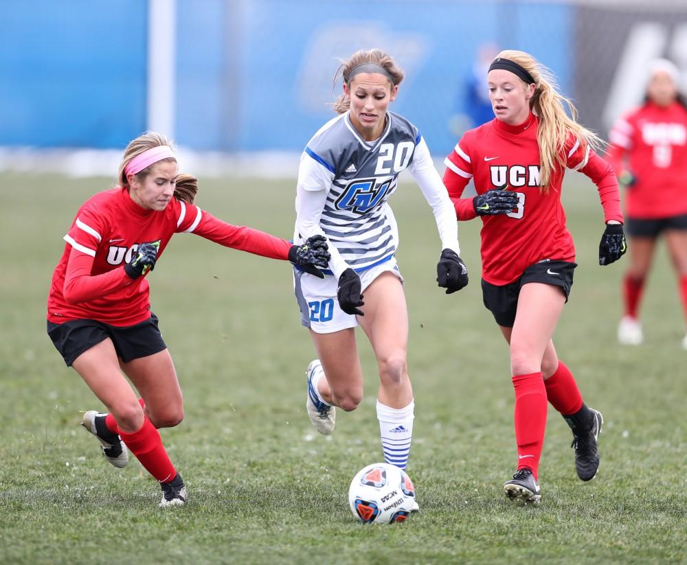 GVL/Kevin Sielaff - Gabriella Mencotti (20) splits the Missouri defense as she makes a move toward the opposing net during the game versus Central Missouri on Sunday, Nov. 20, 2016 in Allendale.