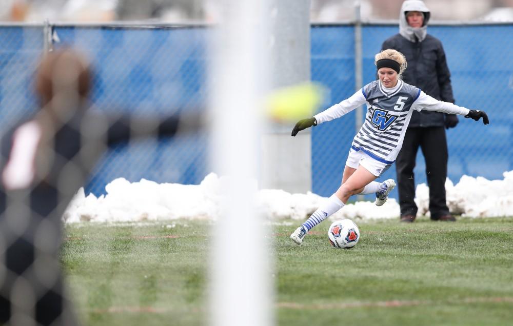 GVL/Kevin Sielaff - Kendra Stauffer (5) jukes her way toward Central Missouri's net during the game versus Central Missouri on Sunday, Nov. 20, 2016 in Allendale.