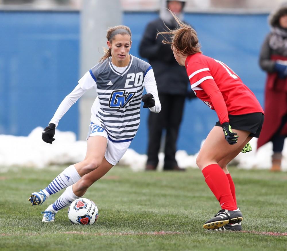 GVL/Kevin Sielaff - Gabriella Mencotti (20) jukes her way toward Central Missouri's net during the game versus Central Missouri on Sunday, Nov. 20, 2016 in Allendale.