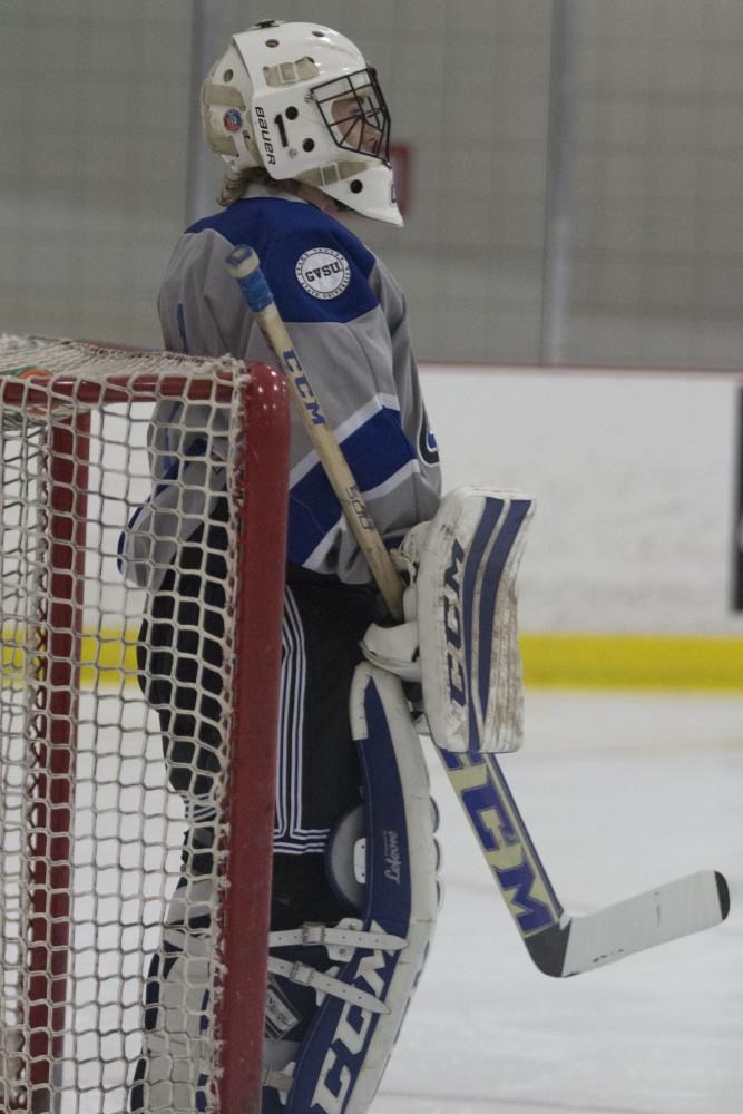 GVL/Mackenzie Bush - Jack Lindsay (1) watches the play closely. GVSU Men’s D3 Hockey plays Michigan State University Saturday, Dec. 10, 2016. 