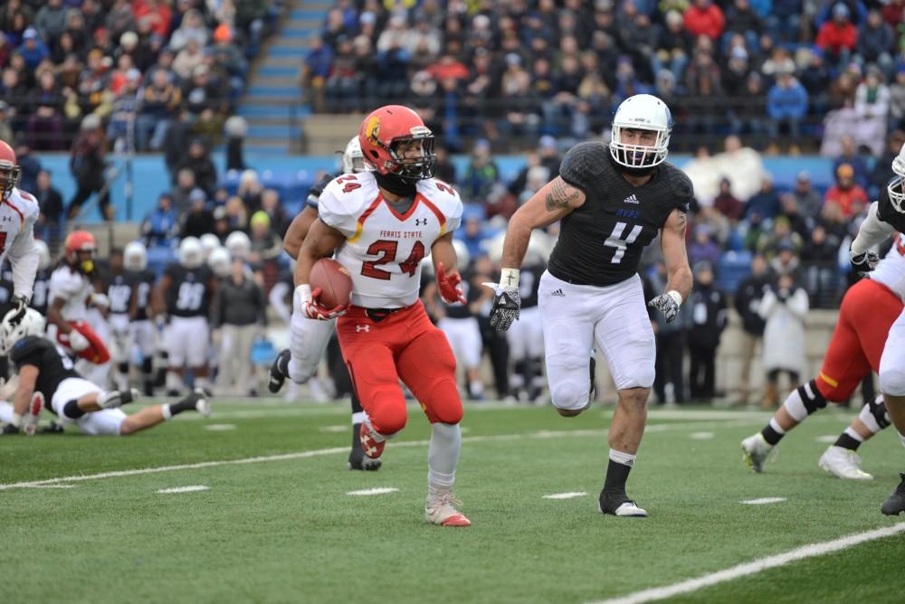 GVL / Luke Holmes - A fan jangles his keys during a “key play”. GVSU lost to Ferris State in Lubbers Stadium on Saturday, Dec. 3, 2016.