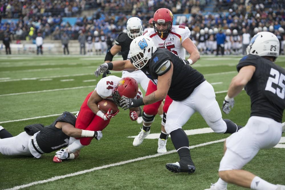 GVL / Luke Holmes - David Talley (7) makes the tackle. GVSU lost to Ferris State in Lubbers Stadium on Saturday, Dec. 3, 2016.