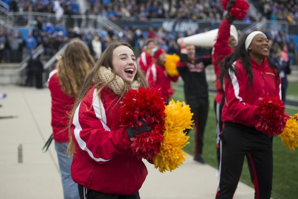 GVL / Luke Holmes - Ferris State cheerleaders cheer from near the bench. GVSU lost to Ferris State in Lubbers Stadium on Saturday, Dec. 3, 2016.