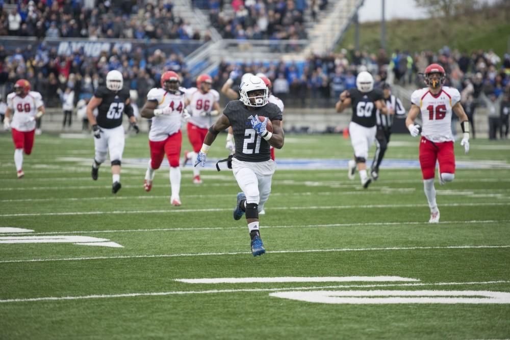 GVL / Luke Holmes - Marty Carter (21) breaks away and runs in the touchdown. GVSU lost to Ferris State in Lubbers Stadium on Saturday, Dec. 3, 2016.